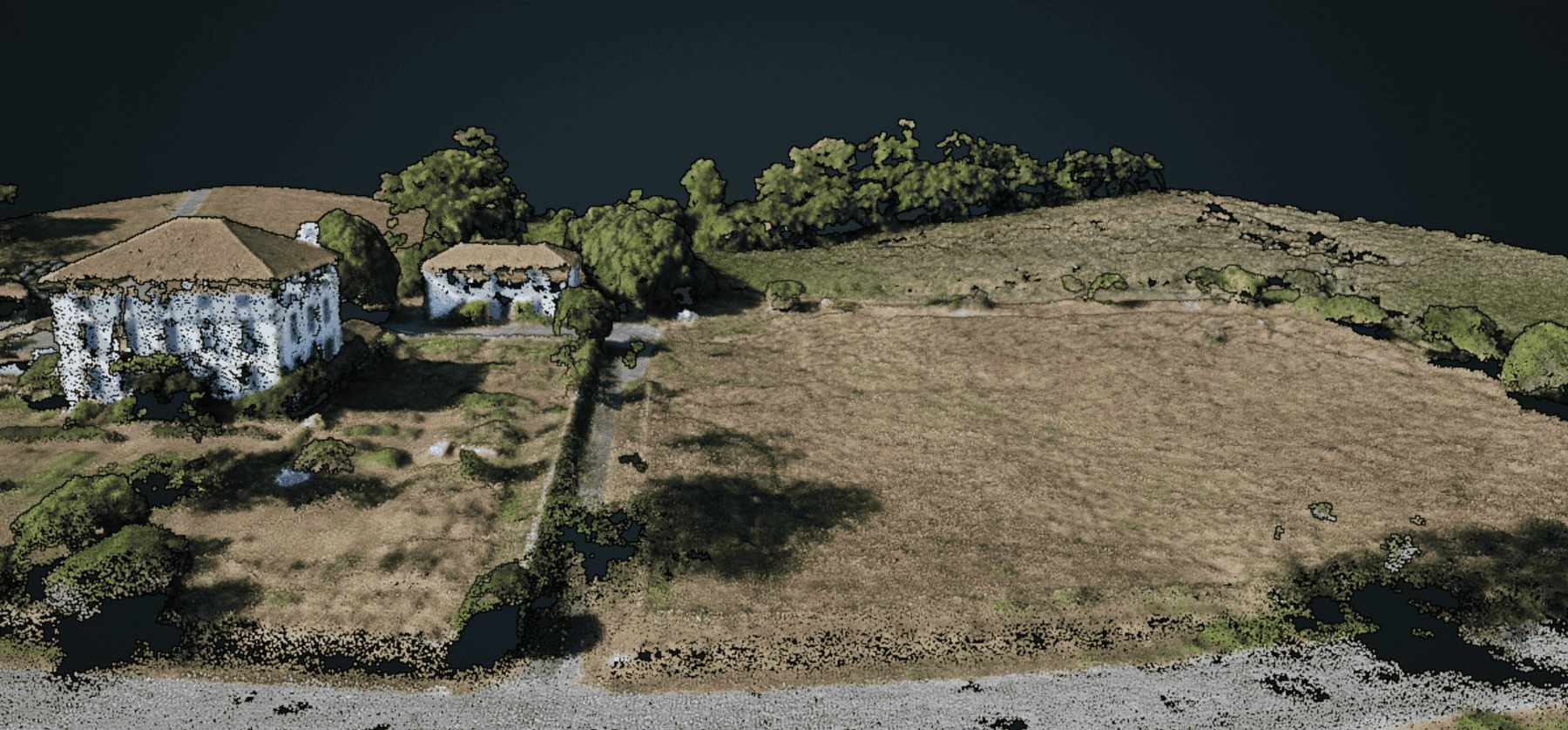 Vue en 3D du terrain et la maison. La 3D est une série de gros point reconstitué à partir des photos